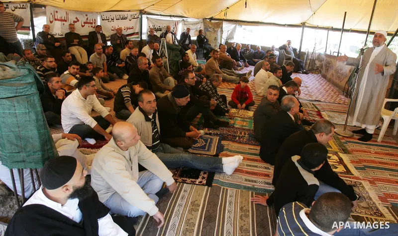 Palestinians attend Friday prayers at the protest tent in the Silwan neighborhood in East Jerusalem on Nov. 11,2011 as Palestinian protesters gather for a demonstration. Photo by Mahfouz Abu Turk