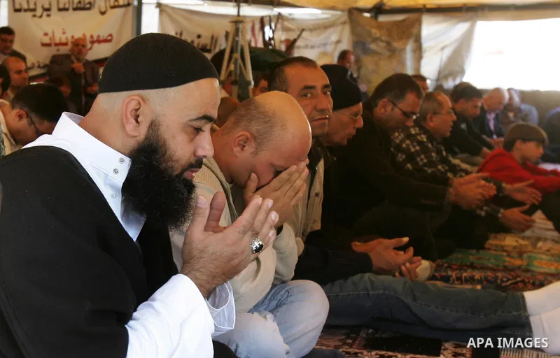 Palestinians attend Friday prayers at the protest tent in the Silwan neighborhood in East Jerusalem on Nov. 11,2011 as Palestinian protesters gather for a demonstration. Photo by Mahfouz Abu Turk