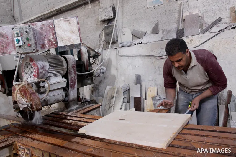 Palestinian worker prepare marble in a factory for marbles in Gaza city on Nov. 13, 2010. Palestinian suffer from decreasing in the industrial materials because of the israeli blockade on Gaza Strip. Photo by Mohammed As...
