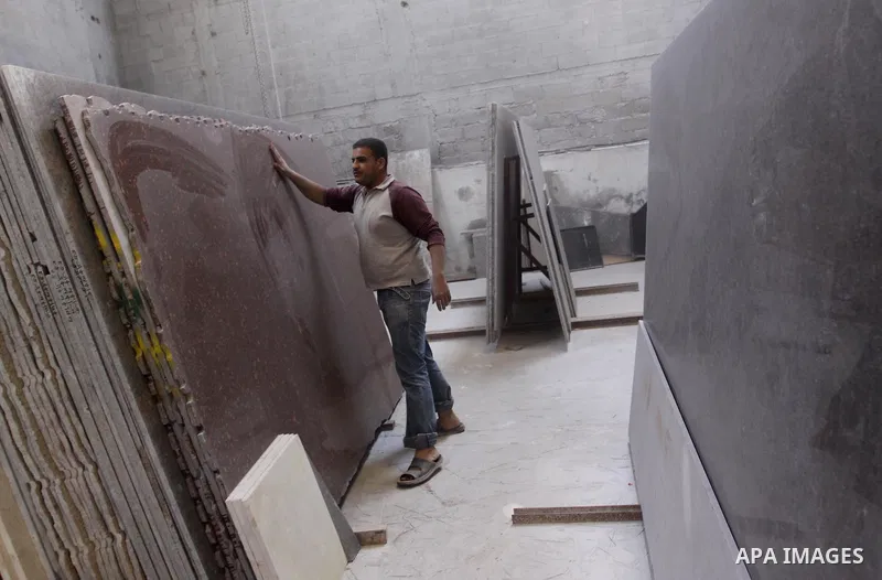 Palestinian worker prepare marble in a factory for marbles in Gaza city on Nov. 13, 2010. Palestinian suffer from decreasing in the industrial materials because of the israeli blockade on Gaza Strip. Photo by Mohammed As...