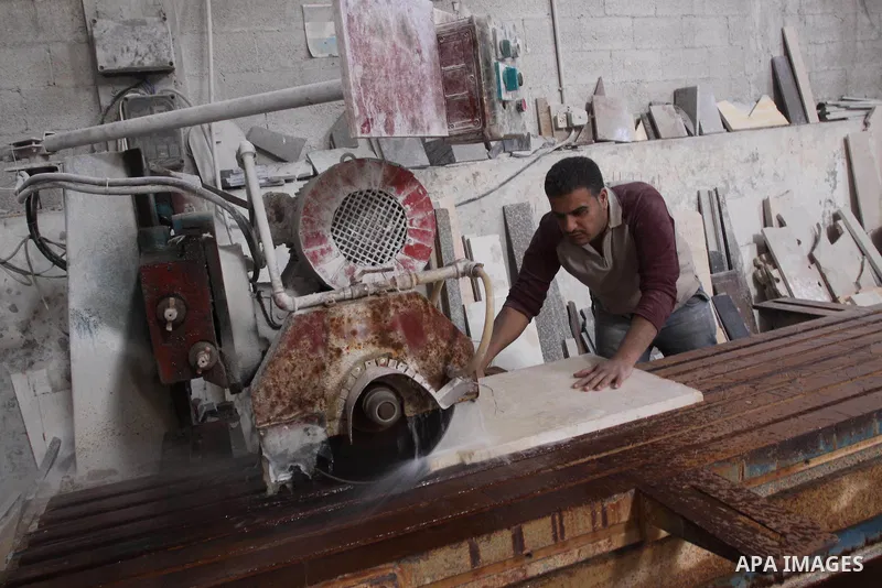 Palestinian worker prepare marble in a factory for marbles in Gaza city on Nov. 13, 2010. Palestinian suffer from decreasing in the industrial materials because of the israeli blockade on Gaza Strip. Photo by Mohammed As...