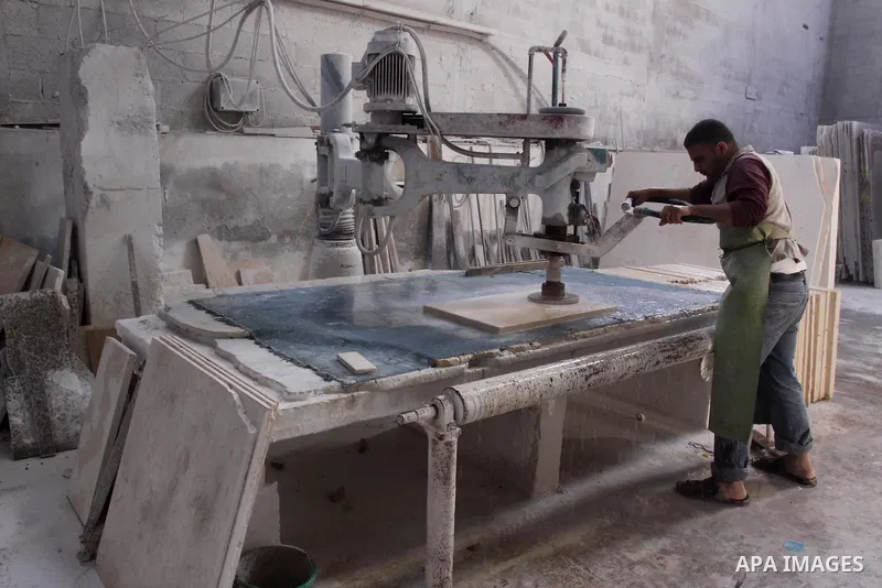 Palestinian worker prepare marble in a factory for marbles in Gaza city on Nov. 13, 2010. Palestinian suffer from decreasing in the industrial materials because of the israeli blockade on Gaza Strip. Photo by Mohammed As...