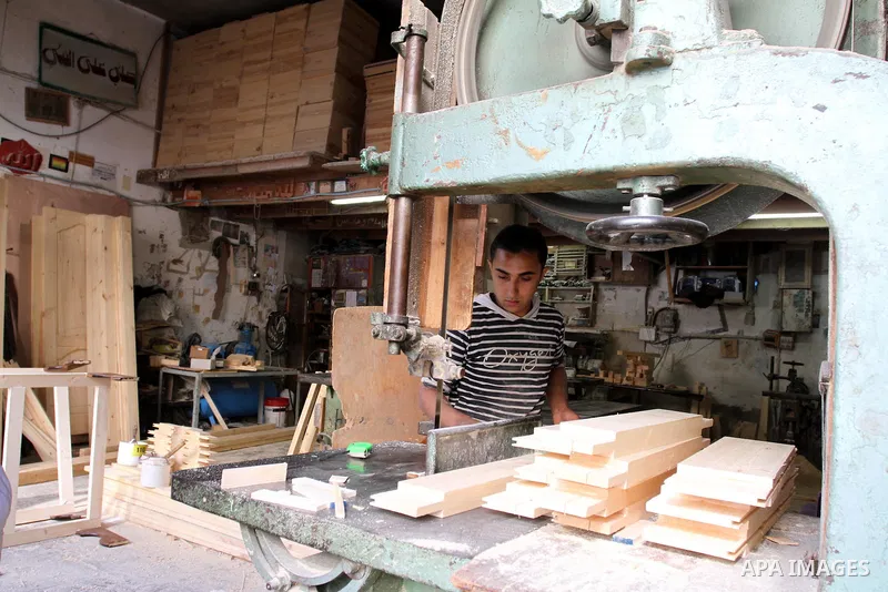 A Palestinian carpenter works at his shop in Gaza city on Nov. 14, 2011. Israel allow the Palestinians to export of furniture to Israel and Europe. Photo by Mohammed Asad