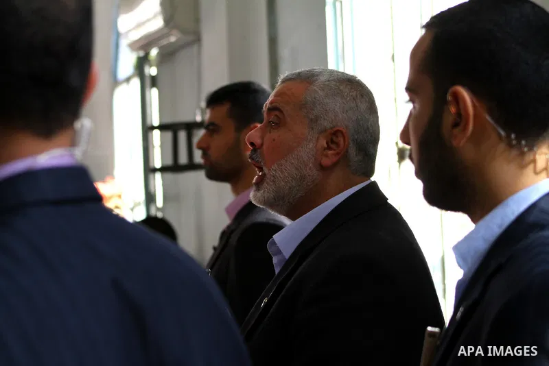 Palestinian prime minister in Gaza Strip, Ismail Haniya attends the funeral of Mohammed Al Kelani, a Hamas security officer, in Beit Lahiya, northern Gaza Strip, Monday, Nov. 14, 2011. Al Kelani was killed in an Israeli...