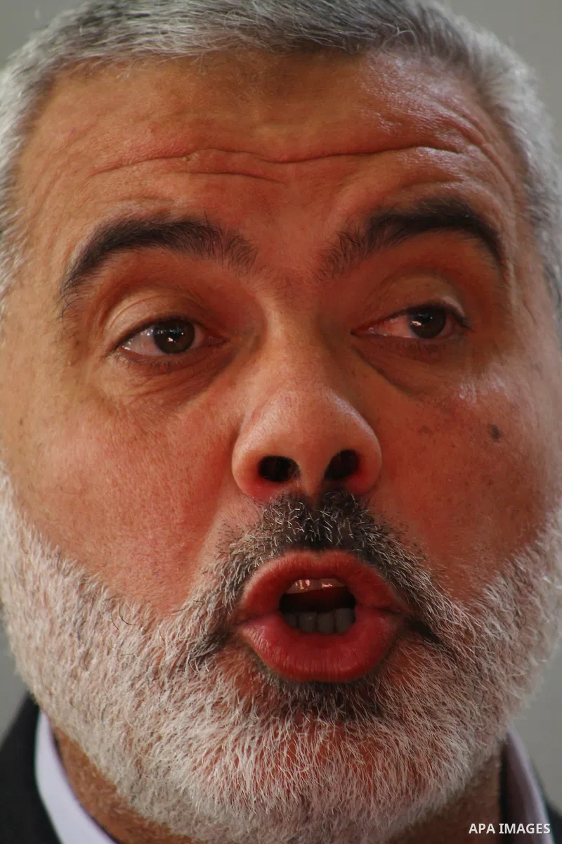 Palestinian prime minister in Gaza Strip, Ismail Haniya attends the funeral of Mohammed Al Kelani, a Hamas security officer, in Beit Lahiya, northern Gaza Strip, Monday, Nov. 14, 2011. Al Kelani was killed in an Israeli...