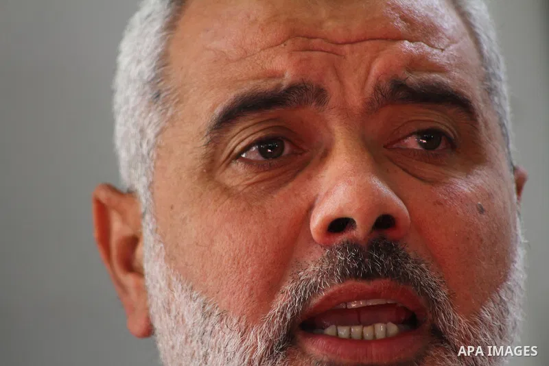 Palestinian prime minister in Gaza Strip, Ismail Haniya attends the funeral of Mohammed Al Kelani, a Hamas security officer, in Beit Lahiya, northern Gaza Strip, Monday, Nov. 14, 2011. Al Kelani was killed in an Israeli...