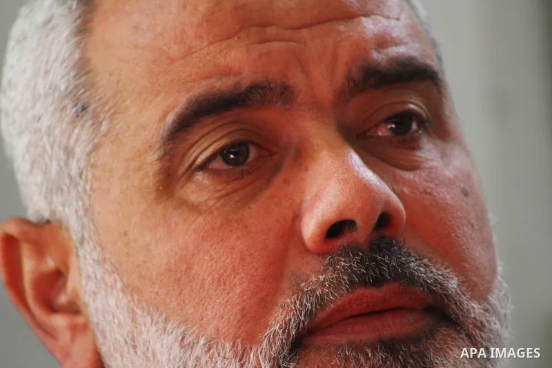 Palestinian prime minister in Gaza Strip, Ismail Haniya attends the funeral of Mohammed Al Kelani, a Hamas security officer, in Beit Lahiya, northern Gaza Strip, Monday, Nov. 14, 2011. Al Kelani was killed in an Israeli...