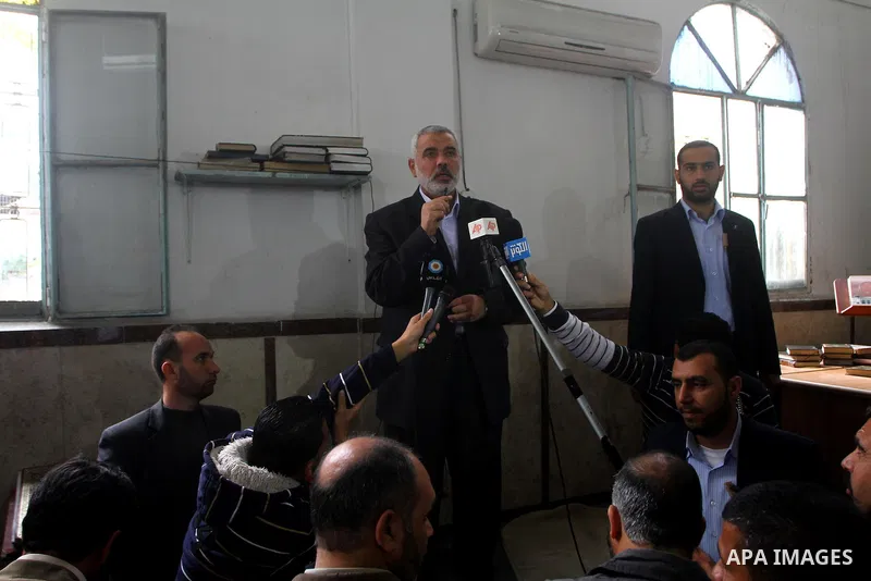 Palestinian prime minister in Gaza Strip, Ismail Haniya attends the funeral of Mohammed Al Kelani, a Hamas security officer, in Beit Lahiya, northern Gaza Strip, Monday, Nov. 14, 2011. Al Kelani was killed in an Israeli...