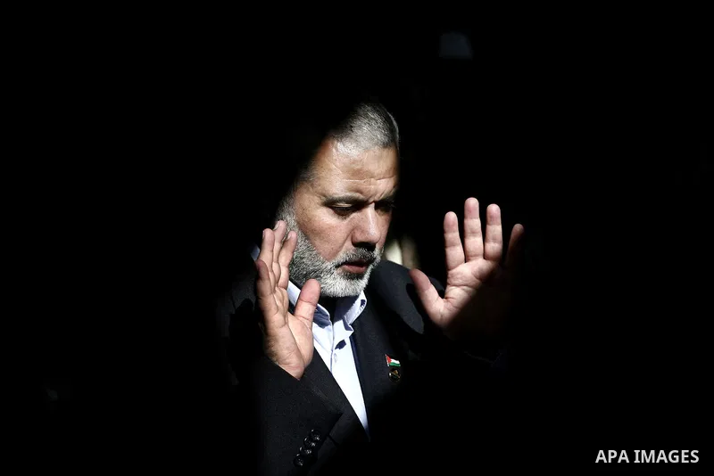 Palestinian prime minister in Gaza Strip, Ismail Haniya attends the funeral of Mohammed Al Kelani, a Hamas security officer, in Beit Lahiya, northern Gaza Strip, Monday, Nov. 14, 2011. Al Kelani was killed in an Israeli...