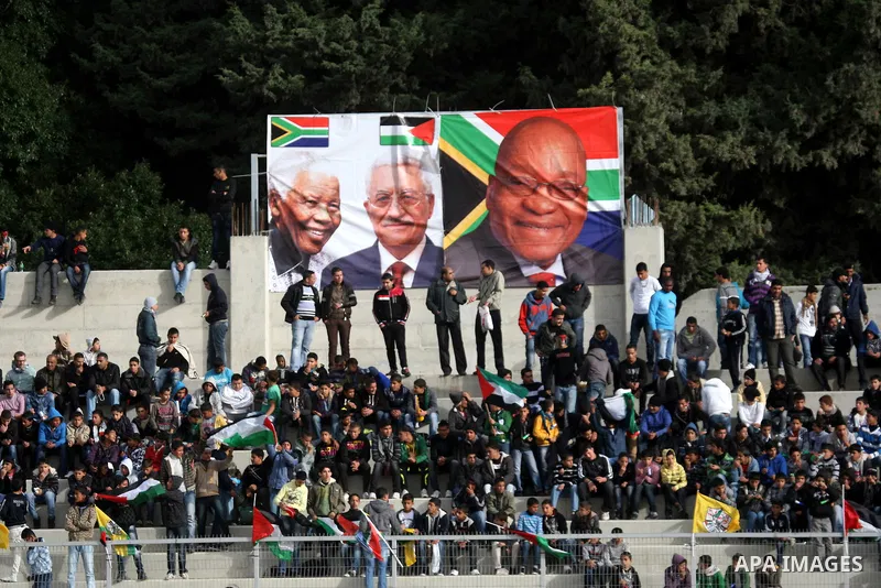 Palestinian fans attend a match between South Africa football team and Palestine team in the West Bank town of Nablus, on Nov. 15, 2011. The match ended in 1-1draw. Photo by Wagdi Eshtayah