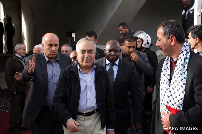 Palestinian Prime Minister, Salam Fayyad attends the football match between Palestine national team and South Africa team in the West Bank city of Nablus on Nov. 15, 2011. Photo by Wagdi Eshtayah