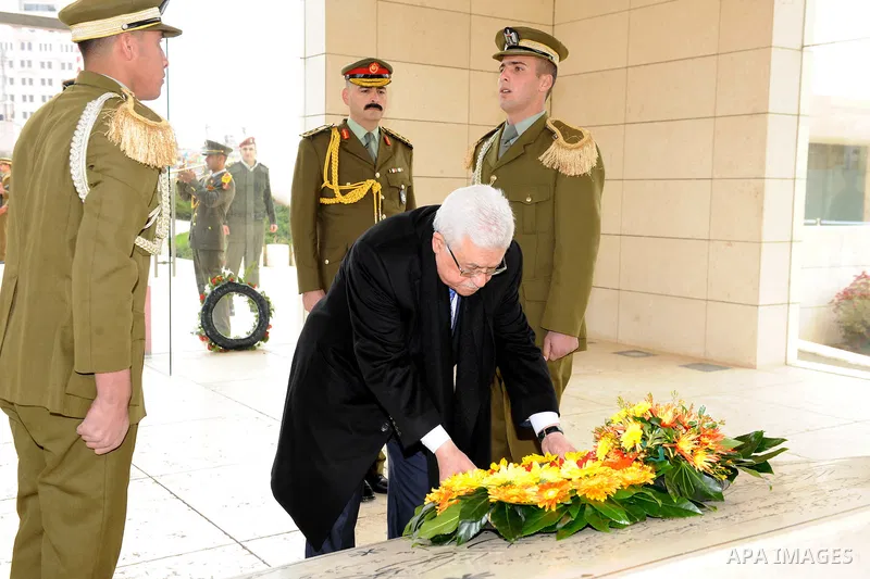 Palestinian leader Mahmud Abbas lays a wreath at the tomb of late leader Yasser Arafat during a celebration on November 16, 2011 in the West Bank city of Ramallah. The celebration was timed to mark seven years since the...