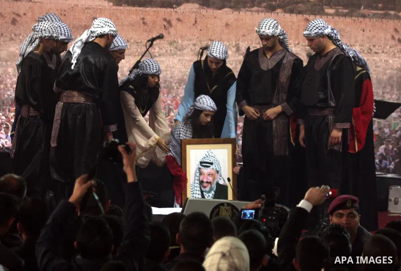 Supporters of the Palestinian President Mahmoud Abbas gather during his speech to the Palestinian leadership on November 16, 2011 in the West Bank city of Ramallah. The address was timed to mark seven years since the dea...