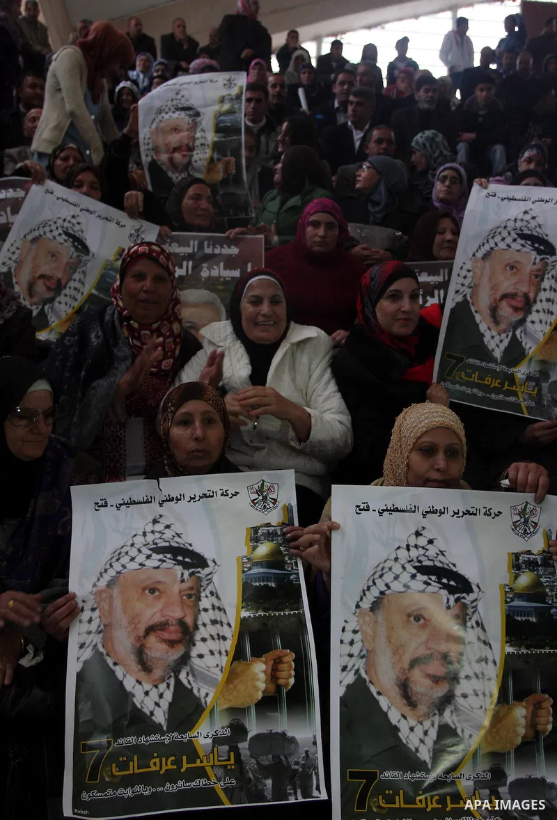 Supporters of the Palestinian President Mahmoud Abbas gather during his speech to the Palestinian leadership on November 16, 2011 in the West Bank city of Ramallah. The address was timed to mark seven years since the dea...