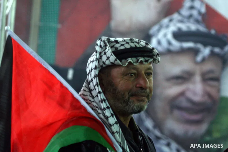 Supporters of the Palestinian President Mahmoud Abbas gather during his speech to the Palestinian leadership on November 16, 2011 in the West Bank city of Ramallah. The address was timed to mark seven years since the dea...