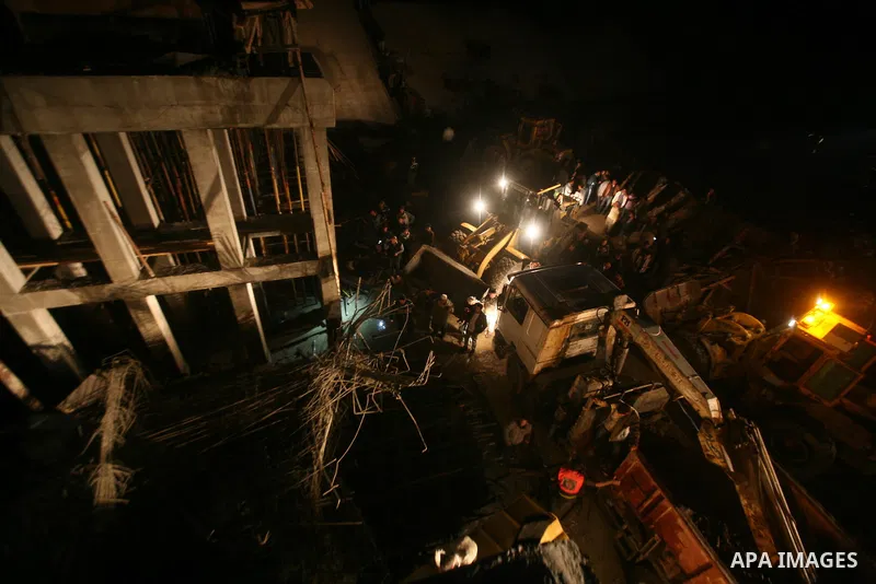 Palestinian rescue teams inspect the scene of a collapsed bridge on a main road in the central Gaza Strip that links Gaza City with the south, near Nusseirat, on November 17, 2011. Medical sources said two Palestinian wo...