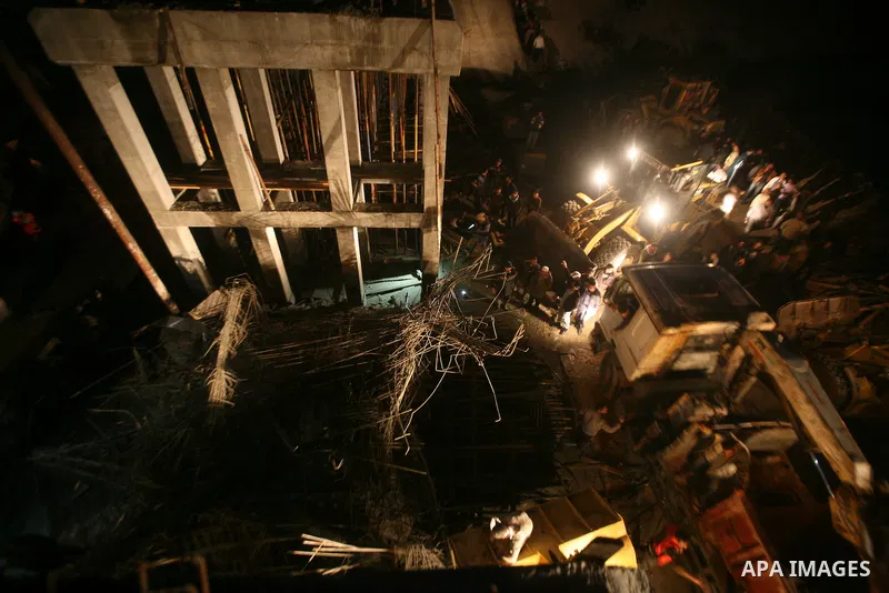 Palestinian rescue teams inspect the scene of a collapsed bridge on a main road in the central Gaza Strip that links Gaza City with the south, near Nusseirat, on November 17, 2011. Medical sources said two Palestinian wo...