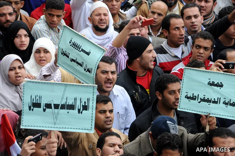 Protesters chant slogans in Tahrir Square, the focal point of the uprising that ousted President Hosni Mubarak, in Cairo, Egypt, Friday, Nov. 18, 2011. Thousands of Egyptians are rallying in Cairo's Tahrir square, with I...