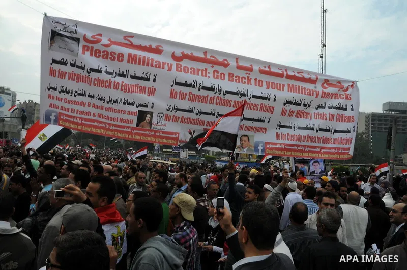 Protesters chant slogans in Tahrir Square, the focal point of the uprising that ousted President Hosni Mubarak, in Cairo, Egypt, Friday, Nov. 18, 2011. Thousands of Egyptians are rallying in Cairo's Tahrir square, with I...