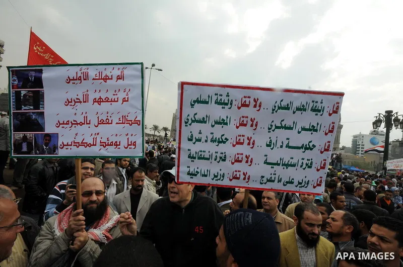 Protesters chant slogans in Tahrir Square, the focal point of the uprising that ousted President Hosni Mubarak, in Cairo, Egypt, Friday, Nov. 18, 2011. Thousands of Egyptians are rallying in Cairo's Tahrir square, with I...