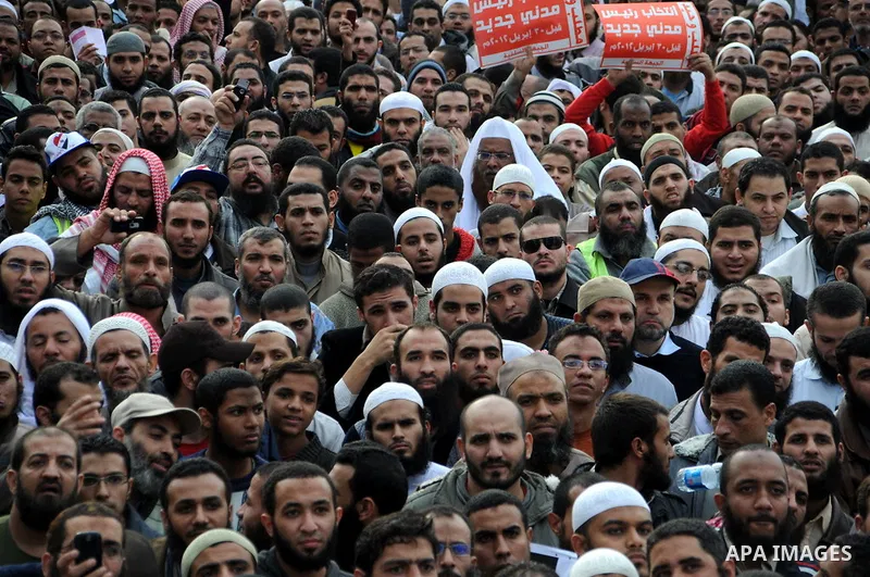 Protesters chant slogans in Tahrir Square, the focal point of the uprising that ousted President Hosni Mubarak, in Cairo, Egypt, Friday, Nov. 18, 2011. Thousands of Egyptians are rallying in Cairo's Tahrir square, with I...