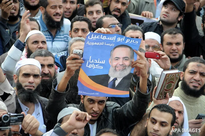 Protesters chant slogans in Tahrir Square, the focal point of the uprising that ousted President Hosni Mubarak, in Cairo, Egypt, Friday, Nov. 18, 2011. Thousands of Egyptians are rallying in Cairo's Tahrir square, with I...