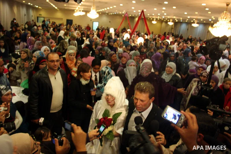 Palestinian freed prisoner Nael Barghouti and his bride Amal Nafea are greeted by relatives and friends during their wedding, in the West Bank city of Ramallah on Nov. 18,2011. Nael Barghouti released from the Israeli ja...