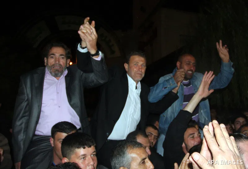 Palestinian freed prisoner Nael Barghouti and his bride Amal Nafea are greeted by relatives and friends during their wedding, in the West Bank city of Ramallah on Nov. 18,2011. Nael Barghouti released from the Israeli ja...