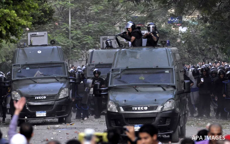 Protesters throw stones at Egyptian riot police during clashes in Tahrir Square in Cairo, Egypt, Saturday, Nov. 19, 2011. Thousands of police clashed with protesters for control of downtown Cairo's Tahrir Square on Satur...