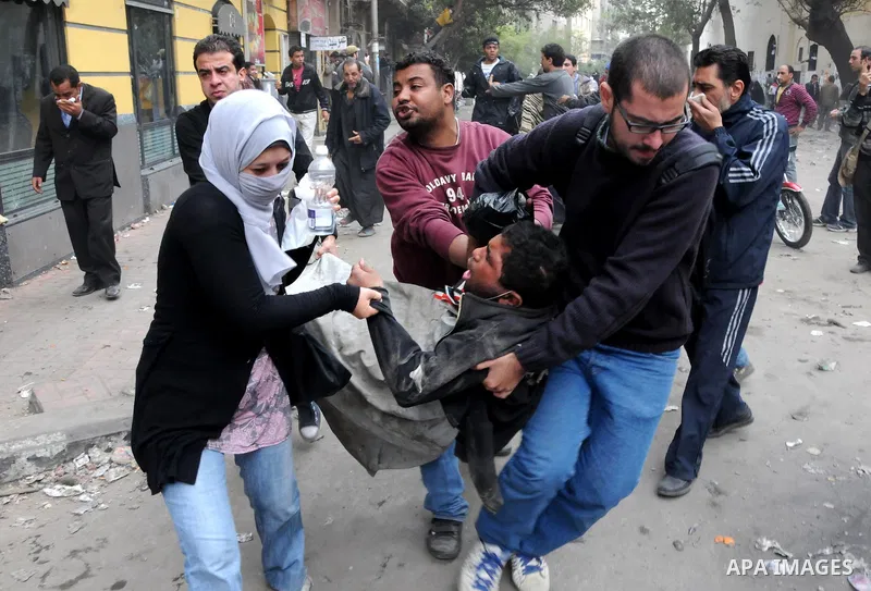 Egyptian youths throw stones at security forces during clashes in Cairo, Egypt, 20 November 2011. According to media sources, hundreds of protesters took control of Tahrir Square in the Egyptian capital on 20 November, f...