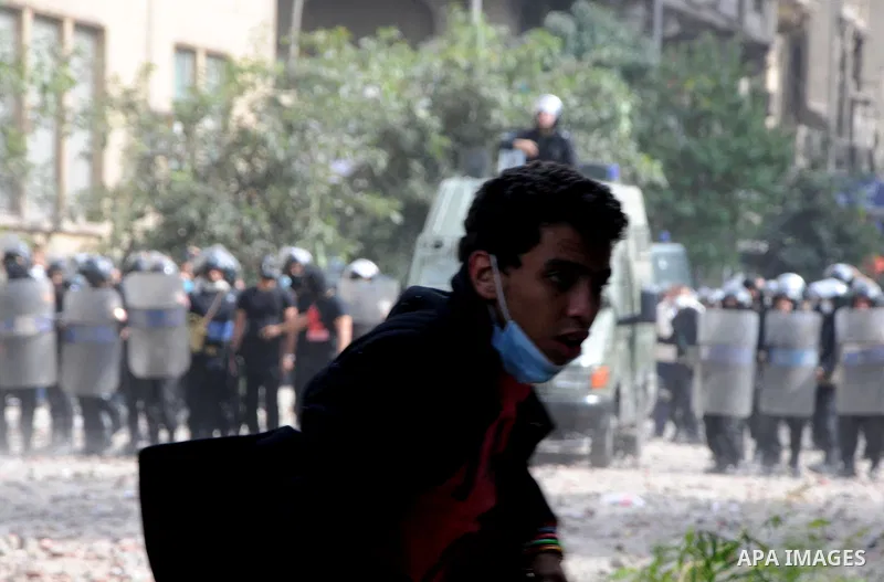 Egyptian youths throw stones at security forces during clashes in Cairo, Egypt, 20 November 2011. According to media sources, hundreds of protesters took control of Tahrir Square in the Egyptian capital on 20 November, f...