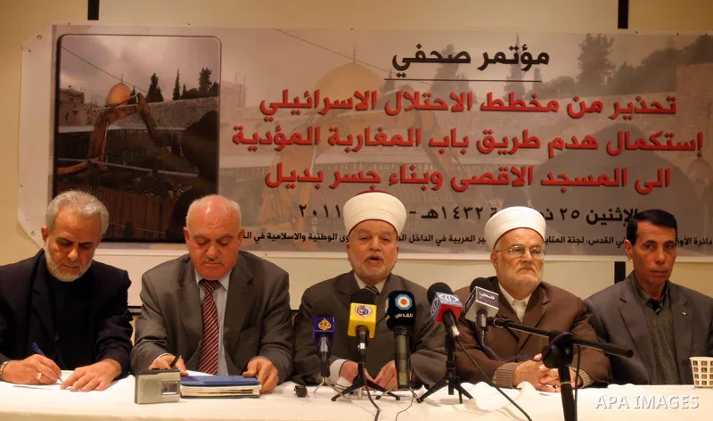 Palestinians take part in a press conference to dicuss the Israeli plan to demolish al-Magharaba gate in Jerusalem's old city, on Nov. 21, 2011. Photo by Mahfouz Abu Turk