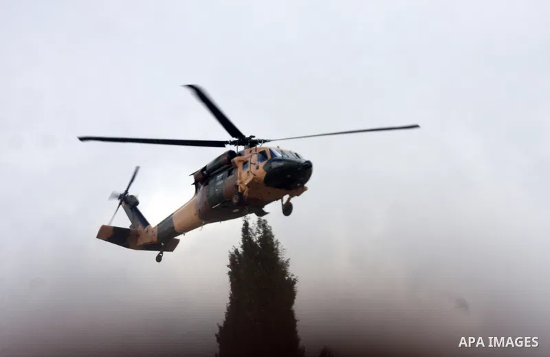 A Jordanian helicopter flies as Palestinian President Mahmoud Abbas and King Abdullah of Jordan meet in the West Bank city of Ramallah November 21, 2011. Abdullah arrived in Ramallah on Monday for a rare visit to the Isr...