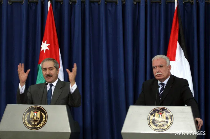 Jordanian Foreign Minister Nasser Judeh and his Palestinian counterpart Riyad al-Malki hold a news conference after the meeting of King Abdullah of Jordan with Palestinian President Mahmoud Abbas in the West Bank city of...