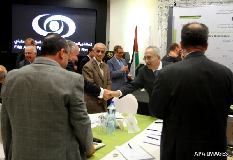 Palestinian Prime Minister Salam Fayyad participate in the opening ceremony of the fifth annual of the Palestinian capital market forum, in the West Bank city of Ramallah November 21, 2011. Photo by Issam Rimawi