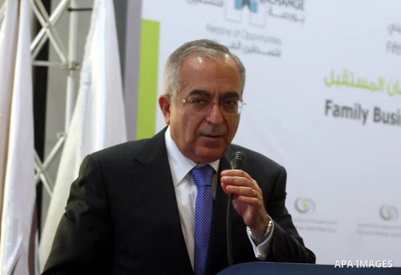 Palestinian Prime Minister Salam Fayyad participate in the opening ceremony of the fifth annual of the Palestinian capital market forum, in the West Bank city of Ramallah November 21, 2011. Photo by Issam Rimawi