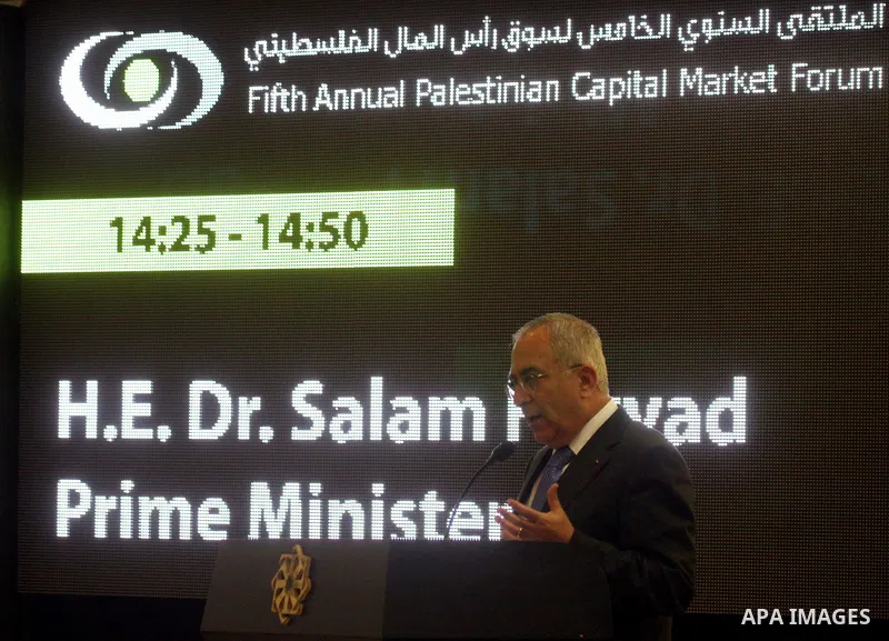 Palestinian Prime Minister Salam Fayyad participate in the opening ceremony of the fifth annual of the Palestinian capital market forum, in the West Bank city of Ramallah November 21, 2011. Photo by Issam Rimawi