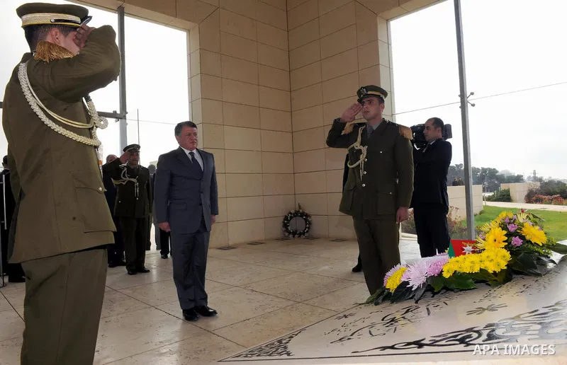 Jordanian King Abdullah II lays a wreath at the tomb of later Palestinian leader Yasser Arafat in the West Bank city of Ramallah on November 21, 2011. Abdullah arrived in Ramallah on Monday for a rare visit to the Israel...