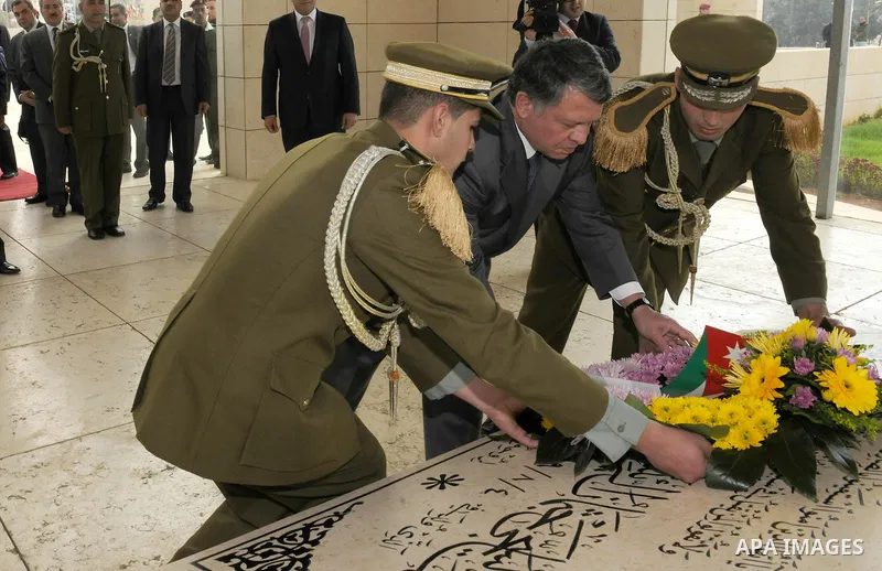 Jordanian King Abdullah II lays a wreath at the tomb of later Palestinian leader Yasser Arafat in the West Bank city of Ramallah on November 21, 2011. Abdullah arrived in Ramallah on Monday for a rare visit to the Israel...
