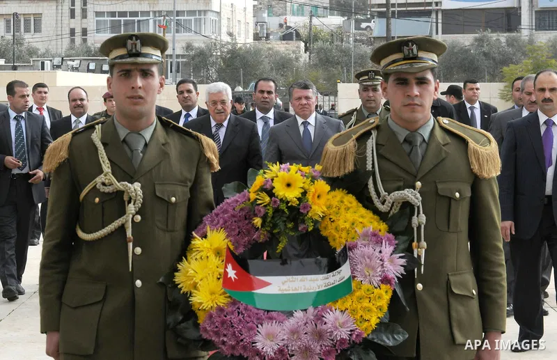 Jordanian King Abdullah II lays a wreath at the tomb of later Palestinian leader Yasser Arafat in the West Bank city of Ramallah on November 21, 2011. Abdullah arrived in Ramallah on Monday for a rare visit to the Israel...
