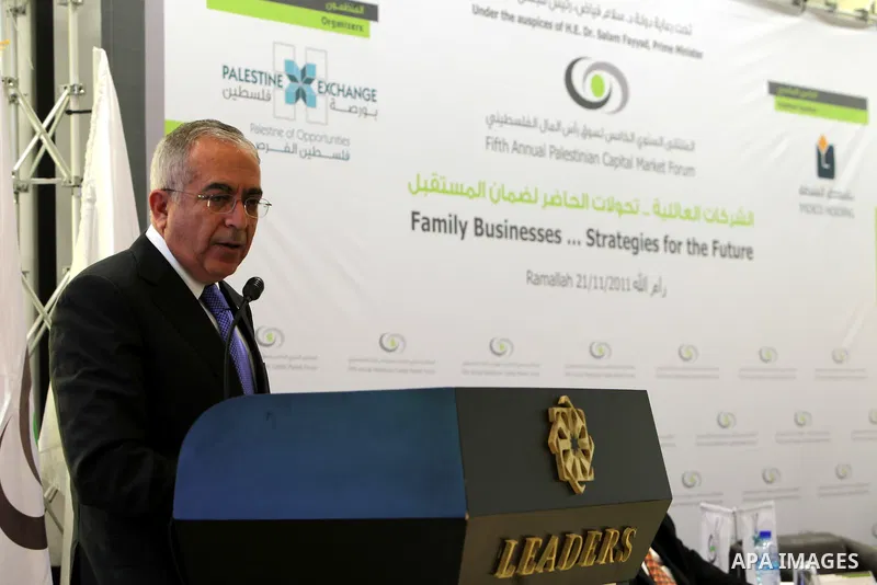 Palestinian Prime Minister Salam Fayyad participate in the opening ceremony of the fifth annual of the Palestinian capital market forum, in the West Bank city of Ramallah November 21, 2011. Photo by Mustafa Abu Dayeh