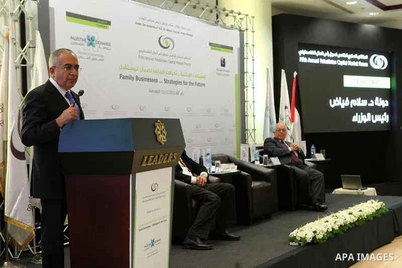 Palestinian Prime Minister Salam Fayyad participate in the opening ceremony of the fifth annual of the Palestinian capital market forum, in the West Bank city of Ramallah November 21, 2011. Photo by Mustafa Abu Dayeh