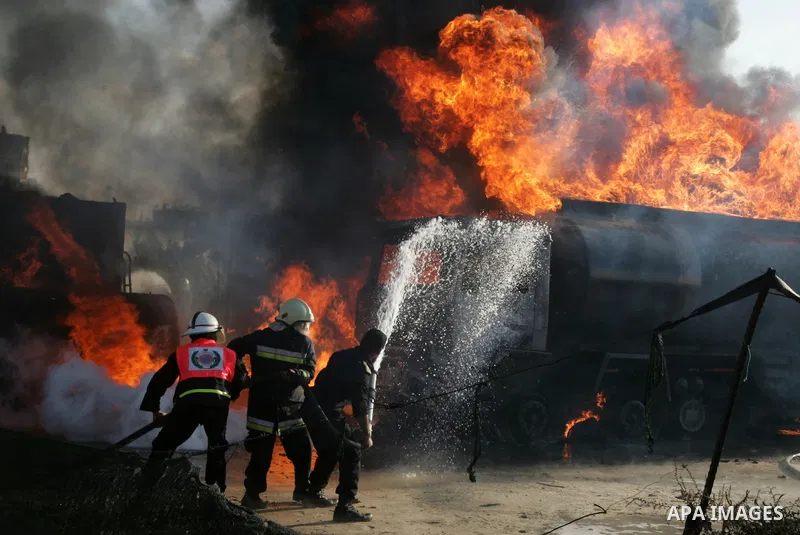 Palestinian firefighters try to extinguish the fire at a smuggle tunnel on the border with Egypt in the southern Gaza Strip town of Rafah on Nov. 21,2011. The cause of the fire is unclear. Photo by Abed Rahim Khatib