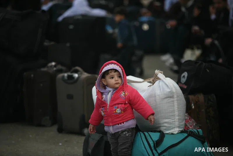 Palestinians wait to cross the Rafah border crossing from the Gaza Strip into Egypt on Nov. 22, 2011. Photo by Mahmud Nassar