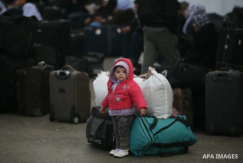 Palestinians wait to cross the Rafah border crossing from the Gaza Strip into Egypt on Nov. 22, 2011. Photo by Mahmud Nassar