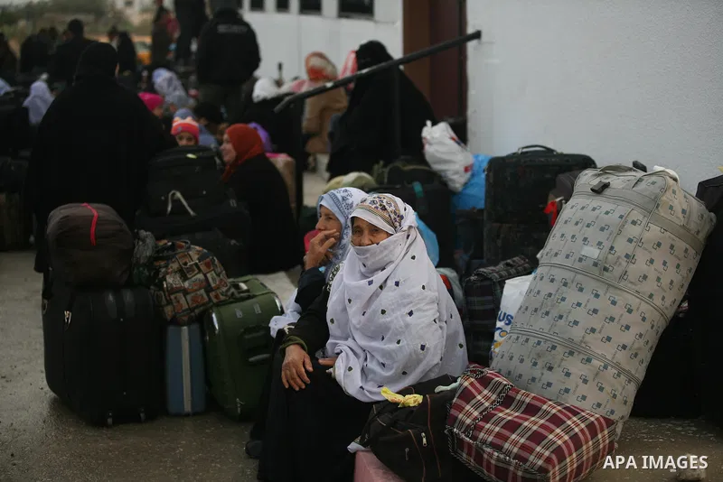 Palestinians wait to cross the Rafah border crossing from the Gaza Strip into Egypt on Nov. 22, 2011. Photo by Mahmud Nassar