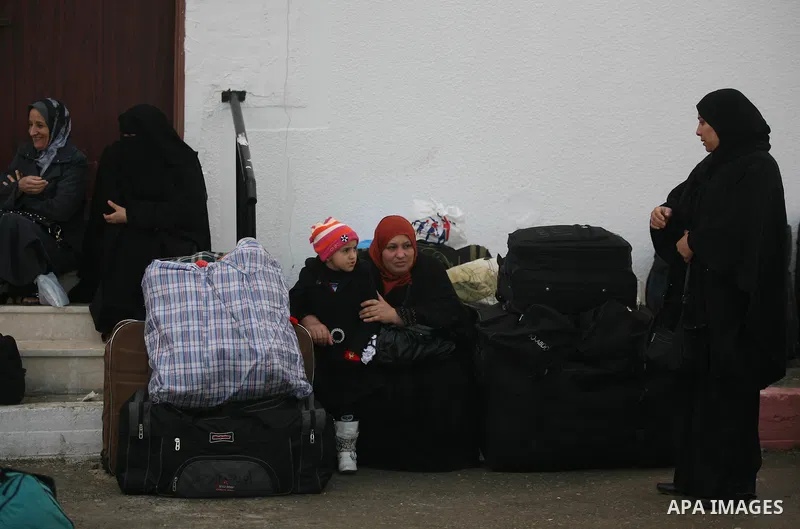 Palestinians wait to cross the Rafah border crossing from the Gaza Strip into Egypt on Nov. 22, 2011. Photo by Mahmud Nassar