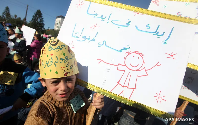 Palestinian children take part in a celebration to mark the International Children Day in Gaza city on Nov. 22,2011. Photo by Majdi Fathi
