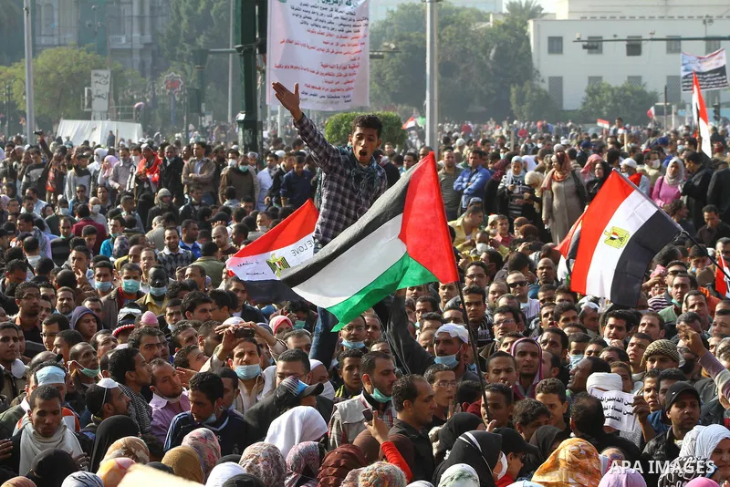 Thousands of Egyptian protesters attend a rally in Tahrir Square on the fourth day of clashes between protesters and riot police in the capital Cairo, on November 22, 2011, as they demand an end to military rule, heighte...
