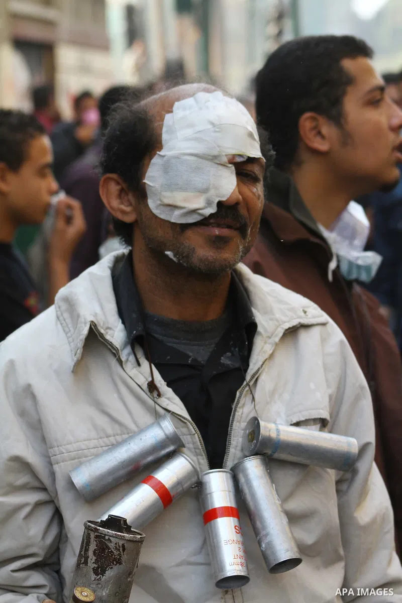 Egyptian protesters clash with riot police in a Cairo street on November 22, 2011. Thousands of protesters swarmed Cairo's Tahrir Square to demand an end to military rule, heightening tension after days of deadly clashes...